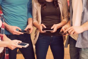 influencers conducting influencer marketing on their cellphones